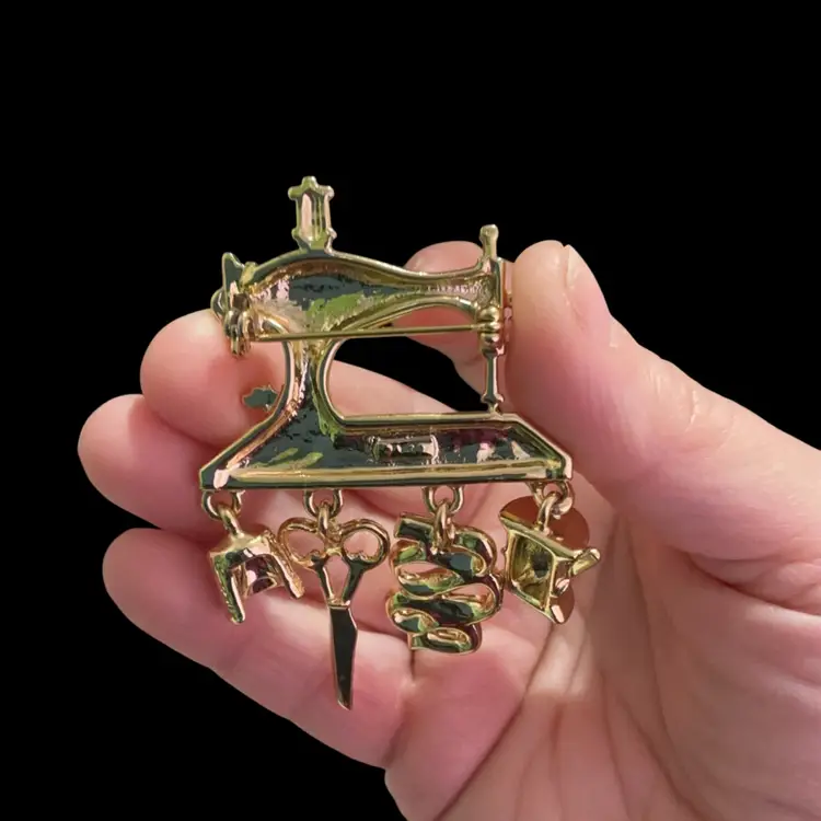 Vintage Brushed Goldtone AJC Sewing Machine Brooch. With Cute Sewing Dangling Charms.
