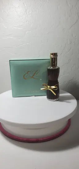 Estee Lauder Youth-Dew Dusting Powder box and a bottle of Youth-Dew Perfume