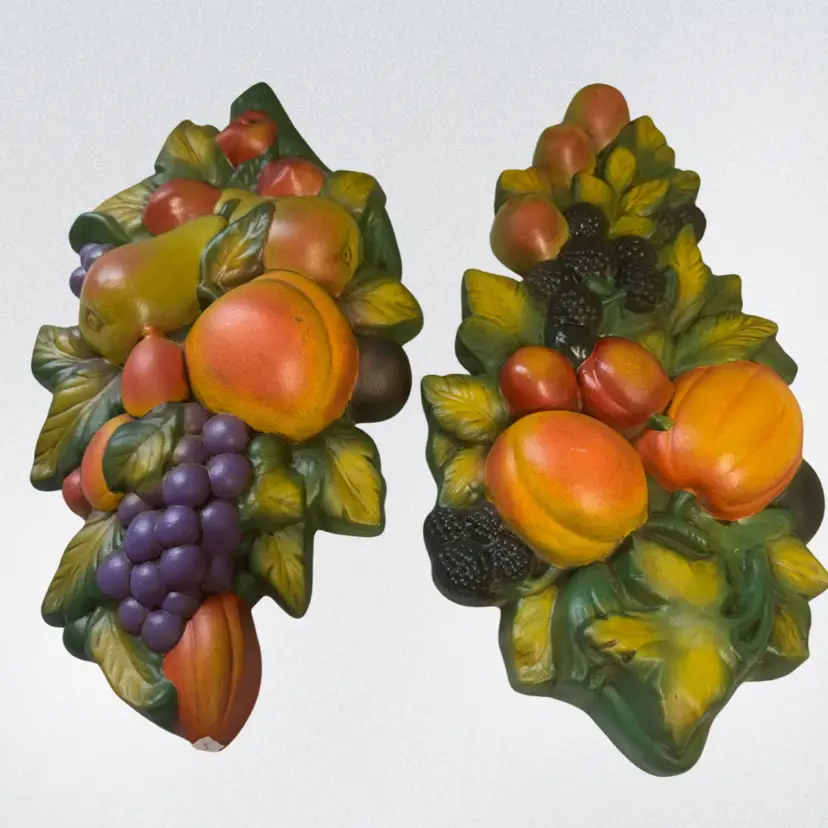 Vintage chalkware fruit wall plaques depicting assorted fruits and leaves. Inscribed “1970”