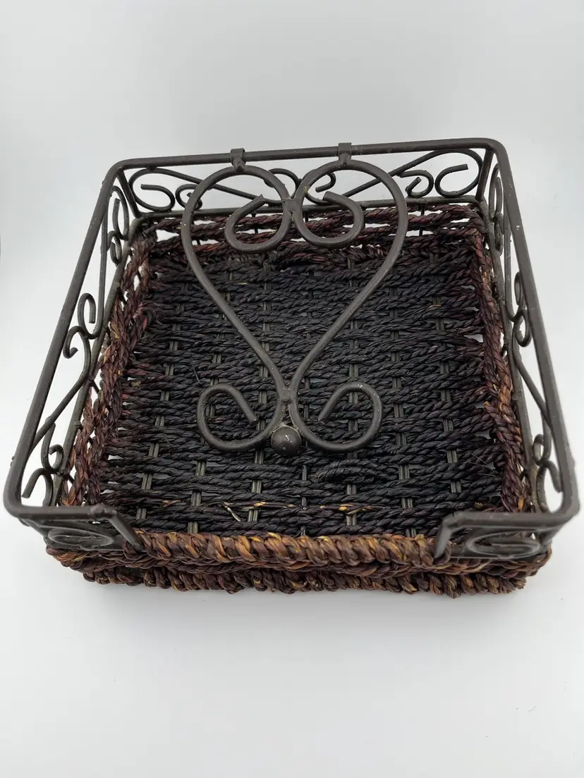 Dark brown wicker, and wrought iron accents & Wrought iron weight to hold napkins in place while outside