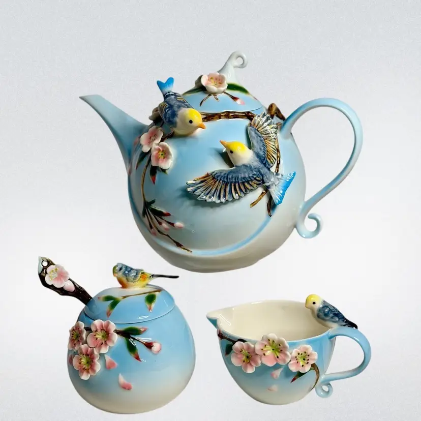 Retired Pier 1 Imports 3D Bird & Cherry Blossom Porcelain Tea Set Hand-Painted 
Set Includes 7” Teapot-3.25” Sugar Bowl with Lid & Spoon- 3.5” T Creamer