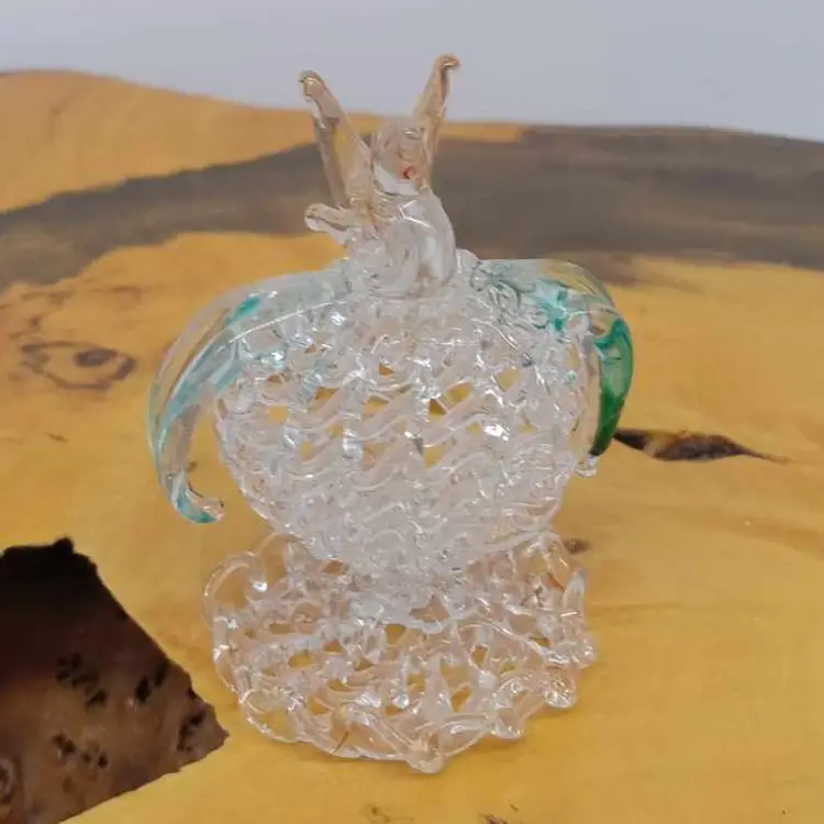 Hand blown spun glass bird on fruit (?)/ flower (?), figurine