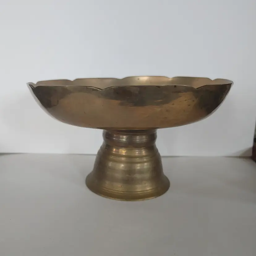 Medium Brass Pedestal Bowl. Scalloped edge. 7.5 inch diameter. 4 inches high.