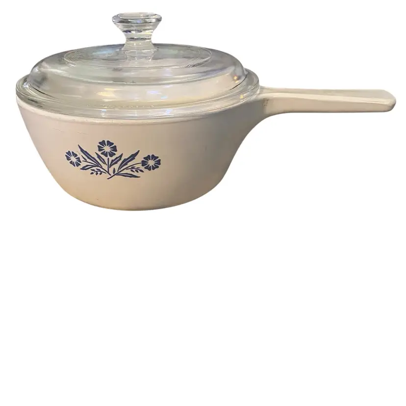 This item is a vintage Corning Ware Blue Cornflower P-82-B saucepan, often referred to as a "menu-ette" skillet, which features the iconic three-flower design first introduced in the 1950s