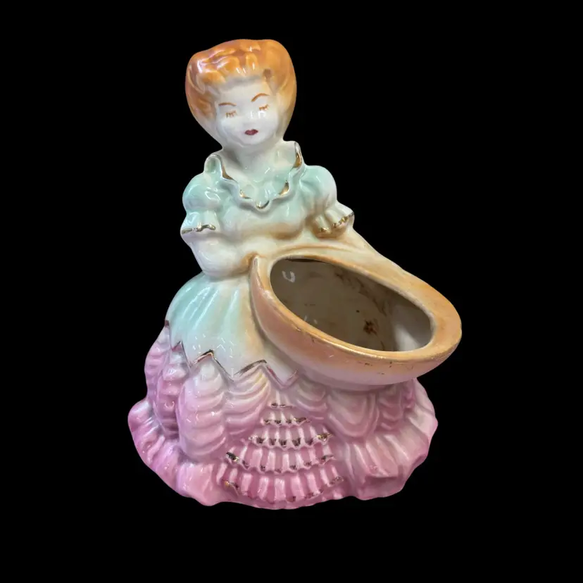 Vintage ceramic Southern Belle figurine planter with pink, green, and gold accents.