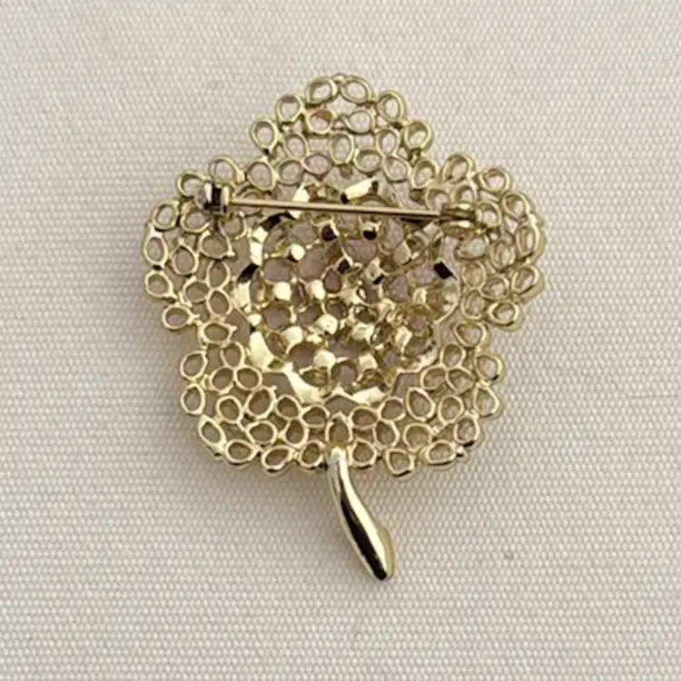 Vintage Aurora Borealis Rhinestone Brooch: Gold Tone Filigree Flower