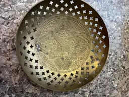 Vintage etched and pierced brass dish with floral motifs.