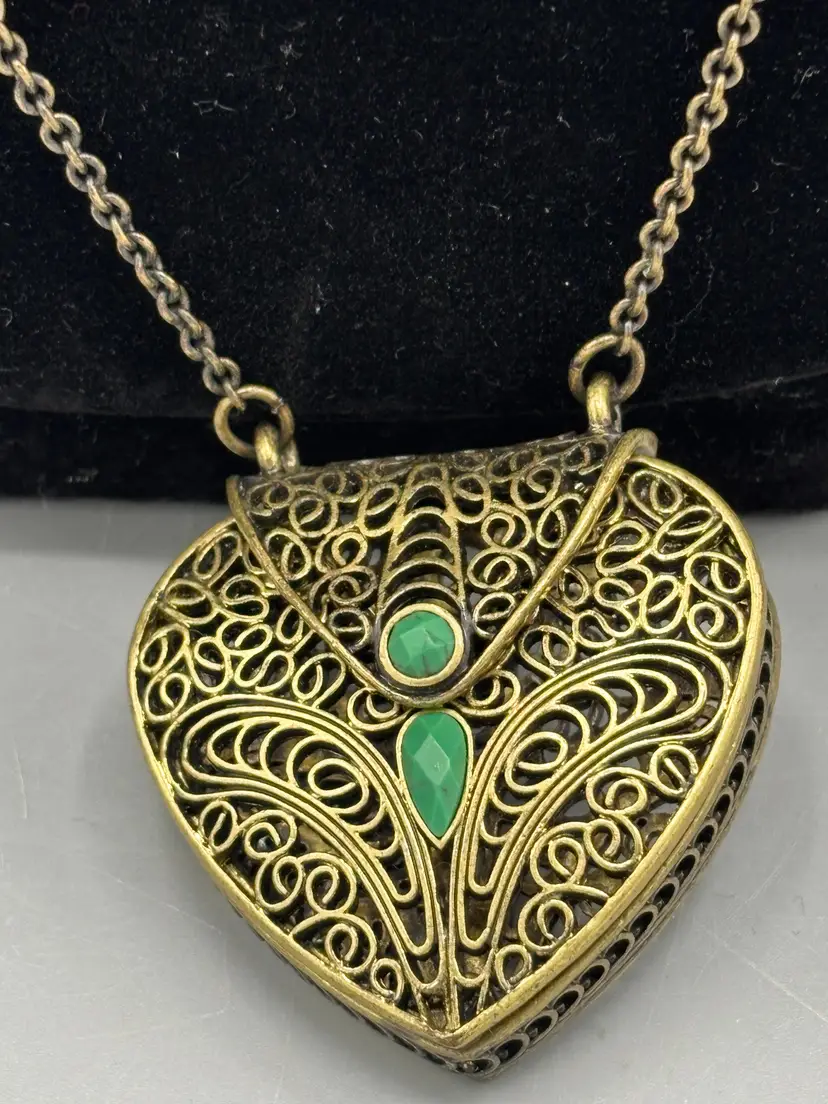 Vintage heart shaped filigree locket with stones
