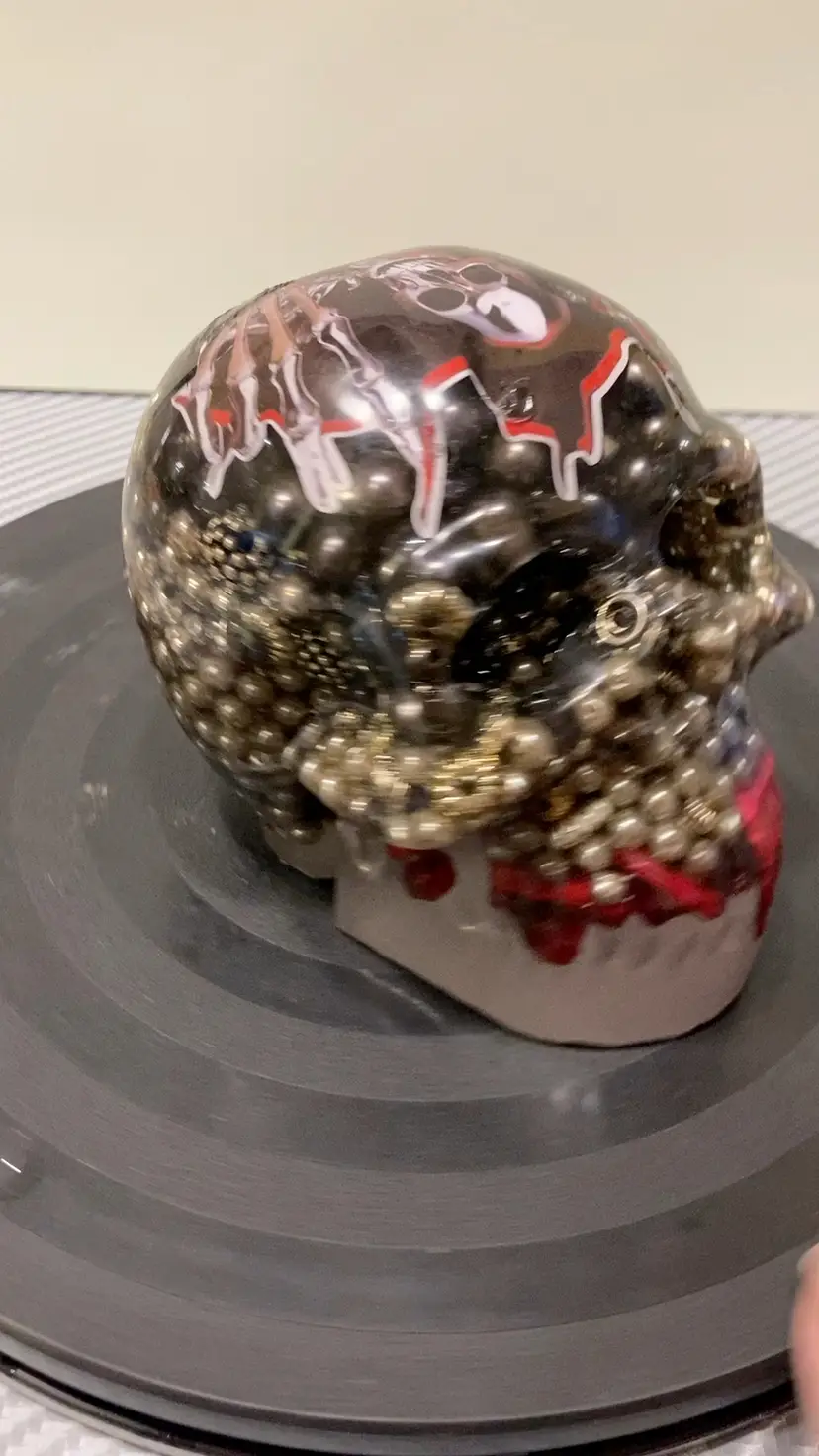 Black, Gray, & Red Resin Skull With Skeleton And Bead Inside