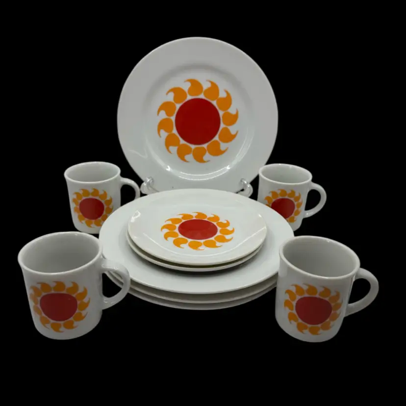 Vintage Japanese ceramic tea set with a red and orange sunburst pattern.