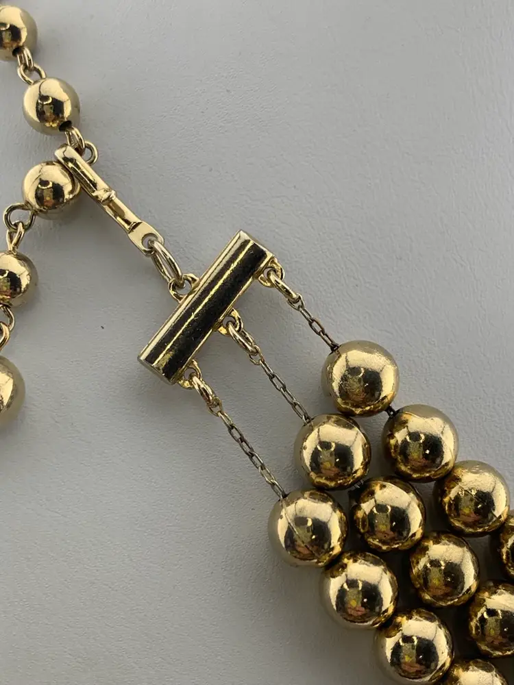 Coro Triple Strand Gold Tone Ball Necklace.