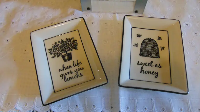 Darling pre owned square trinket dishes made by Andrea by Sadek " When life gives you lemons" and " Sweet as honey" sold as a pair.