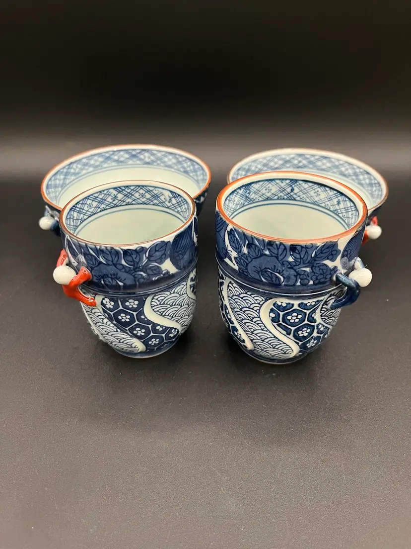 Two Sets Of Japanese Blue Porcelain Rice Bowls & Teacups With People Climbing Up Side