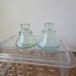 TWO Vintage (antique?) glass ink wells - one green tint, one blue/teal tint