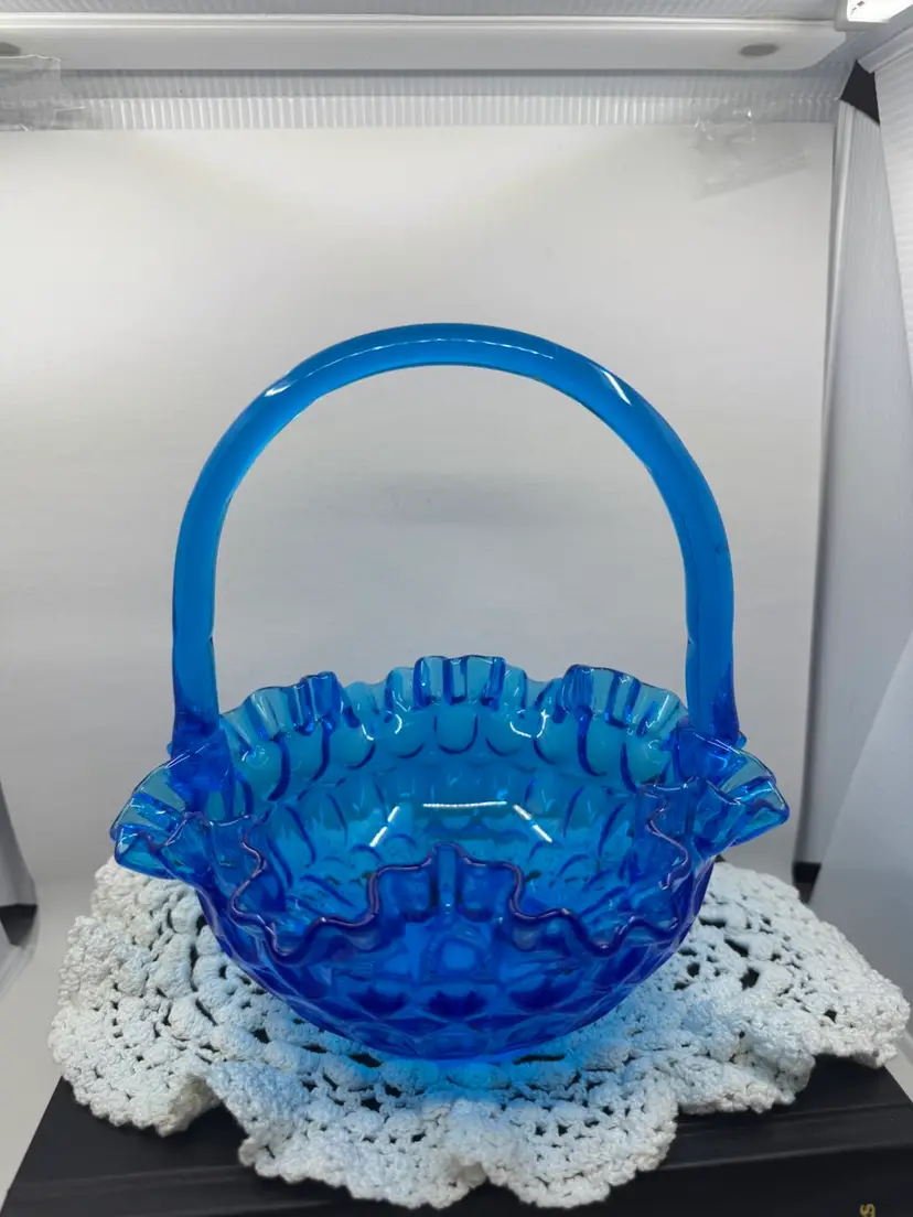 A vintage Fenton cobalt blue glass hobnail basket with a ruffled rim, 8”x8.5”