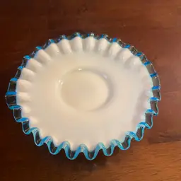 Fenton Aqua Crest milk glass bon bon dish with a blue ruffled edge. 6”