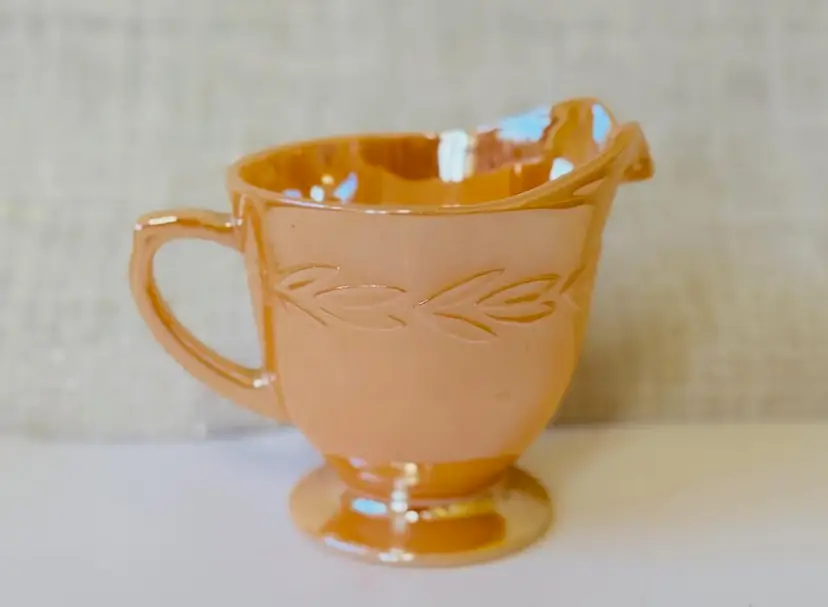 #01 - Fire King Laurel Leaf Carnival Glass Orange Luster Creamer 3" Tall X 4.5" Wide