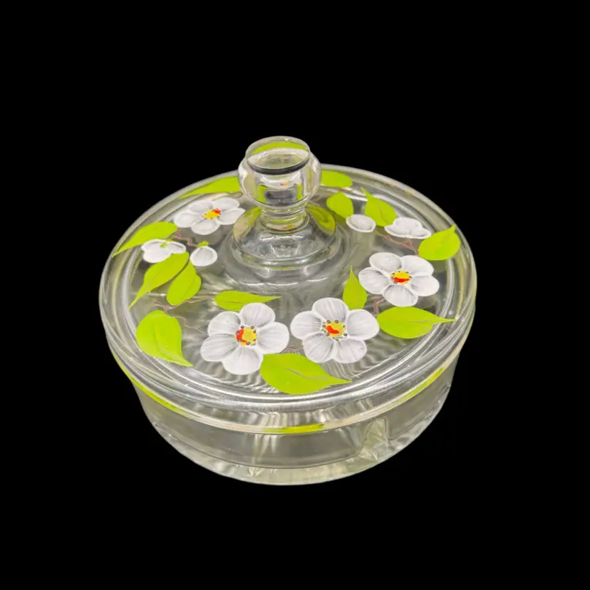 Hand-painted glass lidded candy dish with floral motifs. 6” Wide