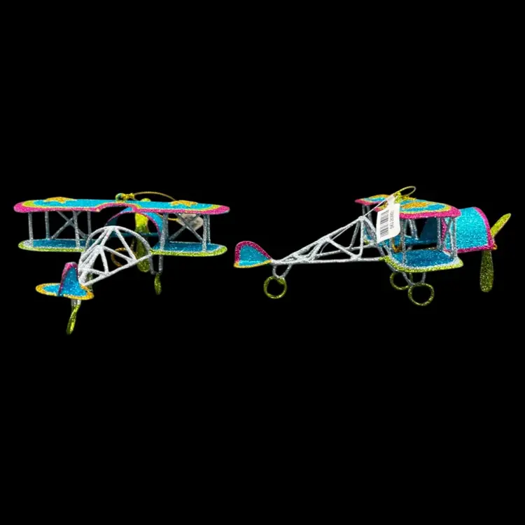 Vintage Pier One Metal Old Biplane Airplane Ornament
Blue Glitter With Pink, Gold And Green Accents 
$5 Each Or 2 For $8
Total Of 5 Available