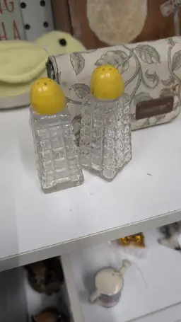 Yellow top salt and pepper shakers