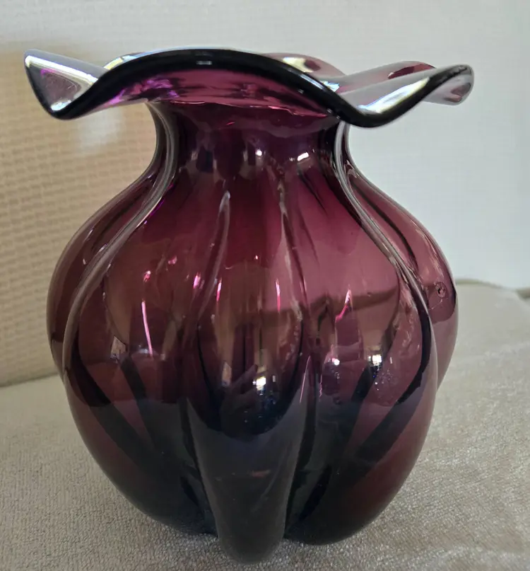 Amethyst Glass Vase With A Ruffled Rim And A Melon Shaped Base