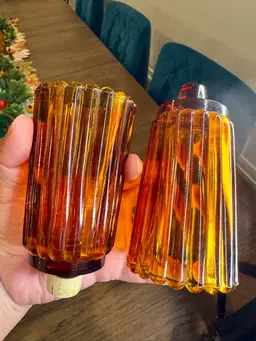 Pair of vintage amber ribbed glass peg votive candle holders, 4.5 inches tall