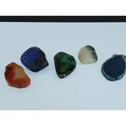 Five Polished Gemstone Pendants