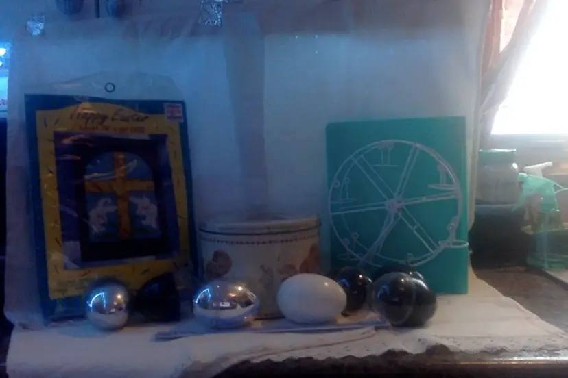 Vintage Beatrix Potter Cookie Tin, Easter Flag, Easter Egg Carousel, and Leggs Eggs.