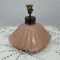 1950’s frosted pink glass perfume atomizer bottle with a metal pump by I. W. Rice & Co.