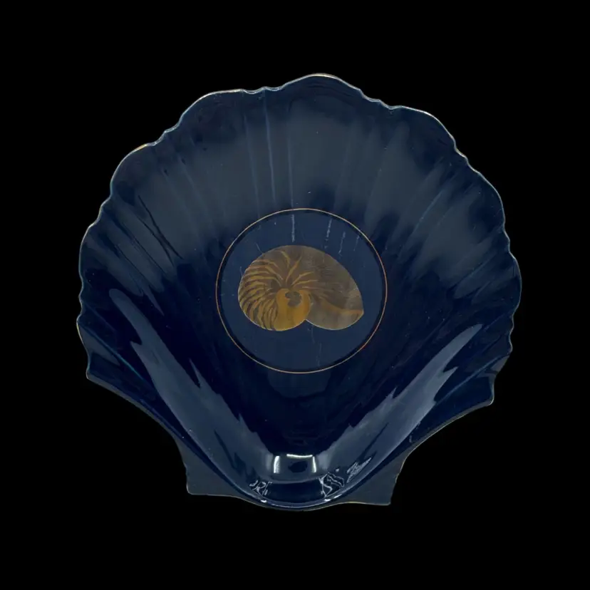 Otagiri ceramic shell-shaped dish with a gold nautilus shell motif.