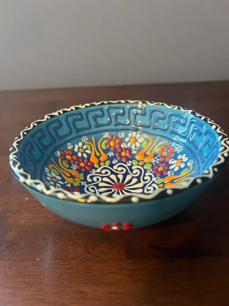 Hand-painted blue ceramic bowl with floral and geometric motifs. Likely from Turkey 5” x 2”