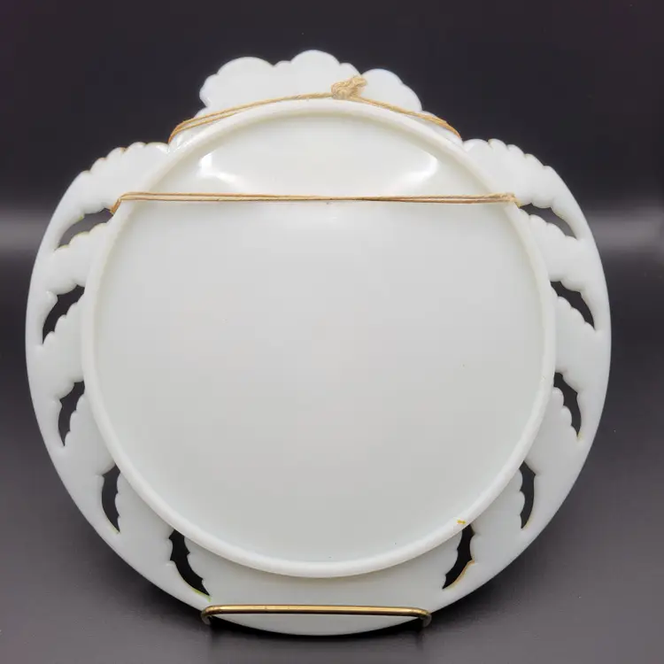 Antique hand painted milk glass plate with puppies and squirrel.