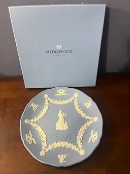 A blue Wedgwood Jasperware collector plate from 2000. 7” In Box