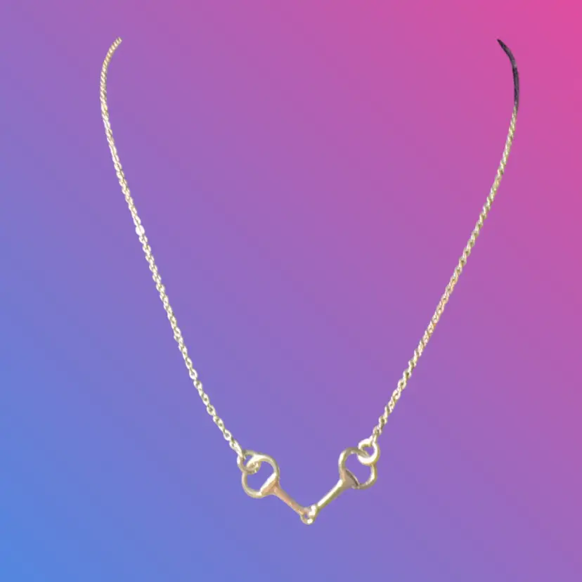 This elegant piece is A Silver Snaffle Bit Necklace,