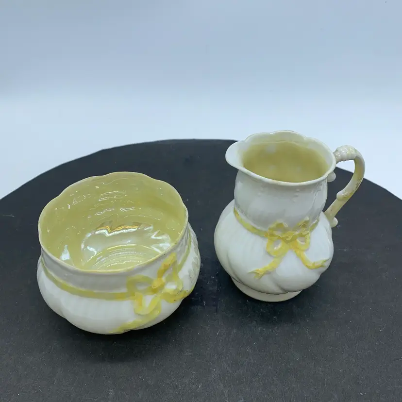 #1809 Unmarked Belleek Pottery creamer and open sugar bowl in the Yellow Ribbon pattern,