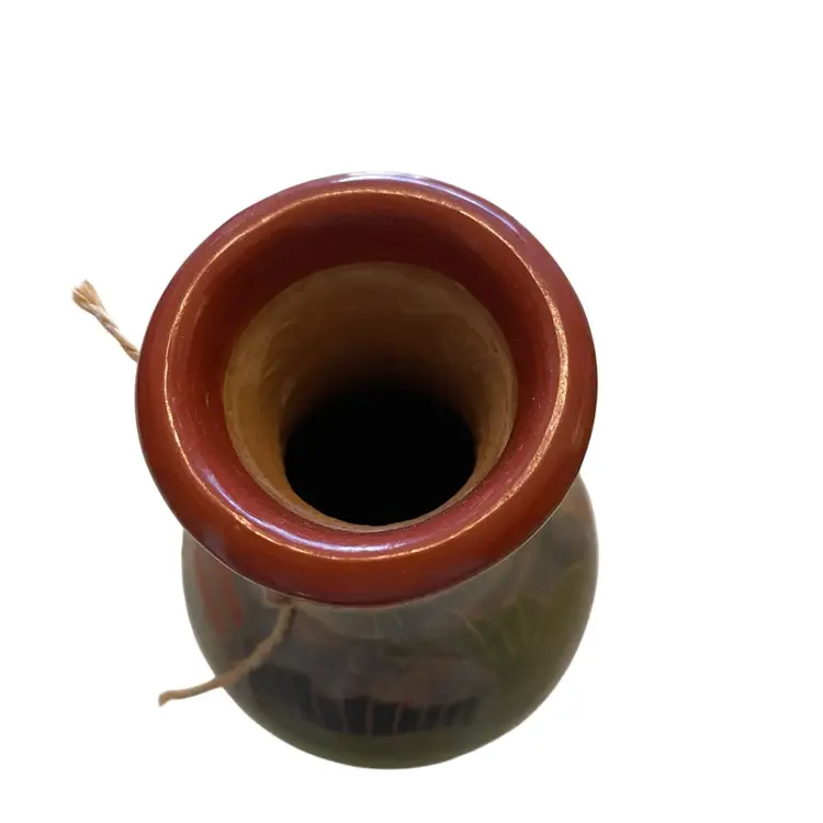 handcrafted folk art pottery, likely from Mexico or Nicaragua, featuring painted fish or aquatic designs. Vase