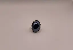 #52 Ring Adjustable Gold Tone Faux Hematite Cabochon Set In A Scalloped Setting