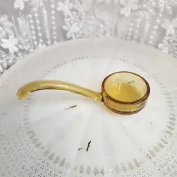 Amber glass sauce spoon