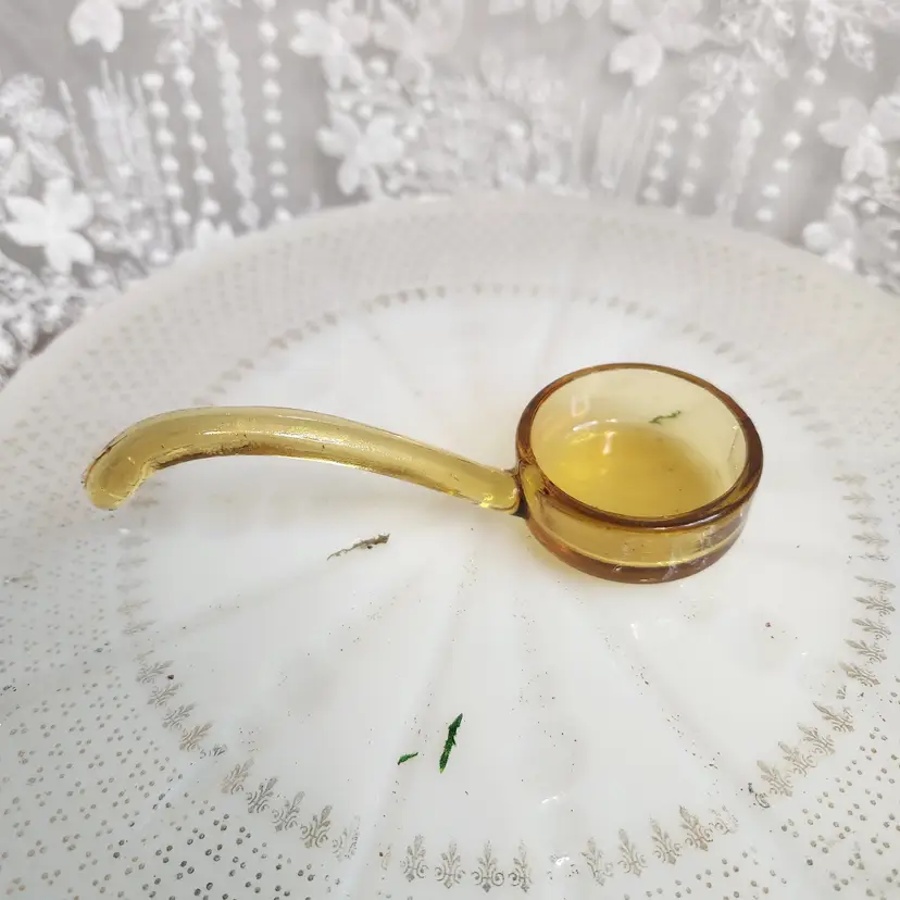 Amber glass sauce spoon