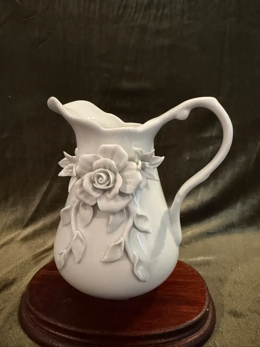 Gorgeous Porcellana De Paris porcelain pitcher with sculpted roses and leaves.
