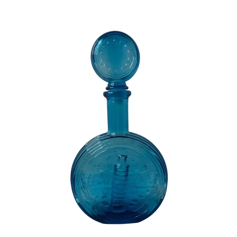 Aqua Blue Decanter Leaning Tower of Pisa Italy 
Glows READ 
10-1/2” x 6”