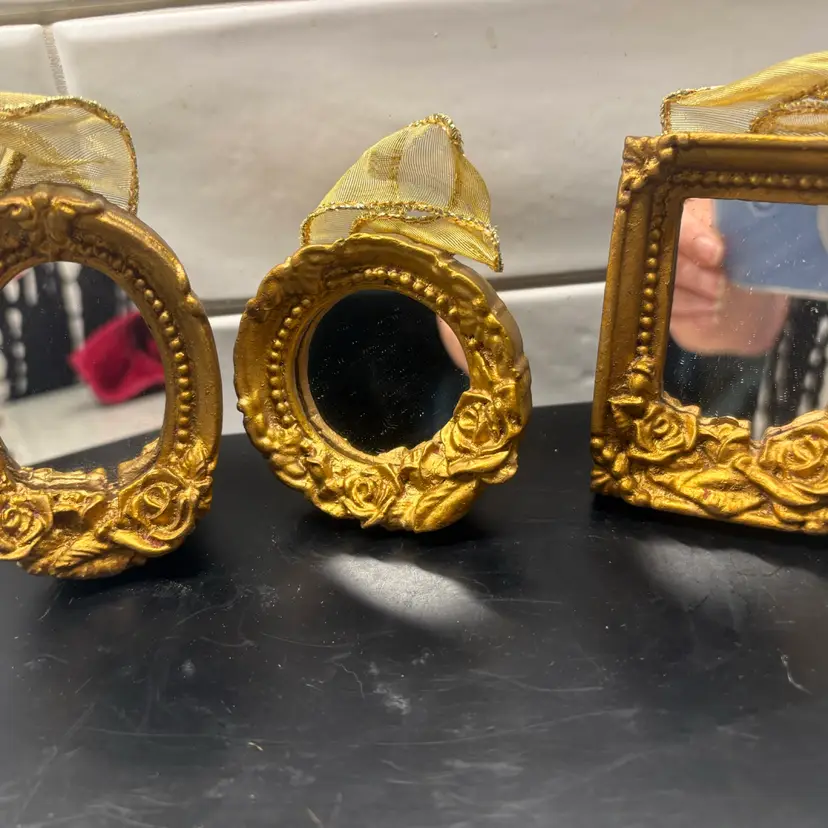 3 miniature mirrors, all gold resin with rose-and-bead baroque frames