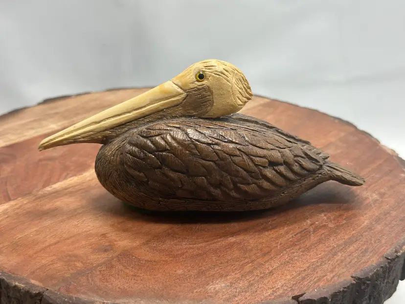 Vintage Carved Wood Composite Sitting Pelican With Glass Eyes