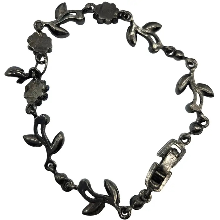 Gorgeous metal link bracelet with blue crystal floral and leaf motifs