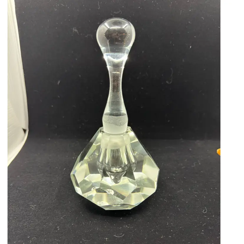 A faceted crystal glass perfume bottle with a bulbous stopper, Stopper Glows, Very Heavy