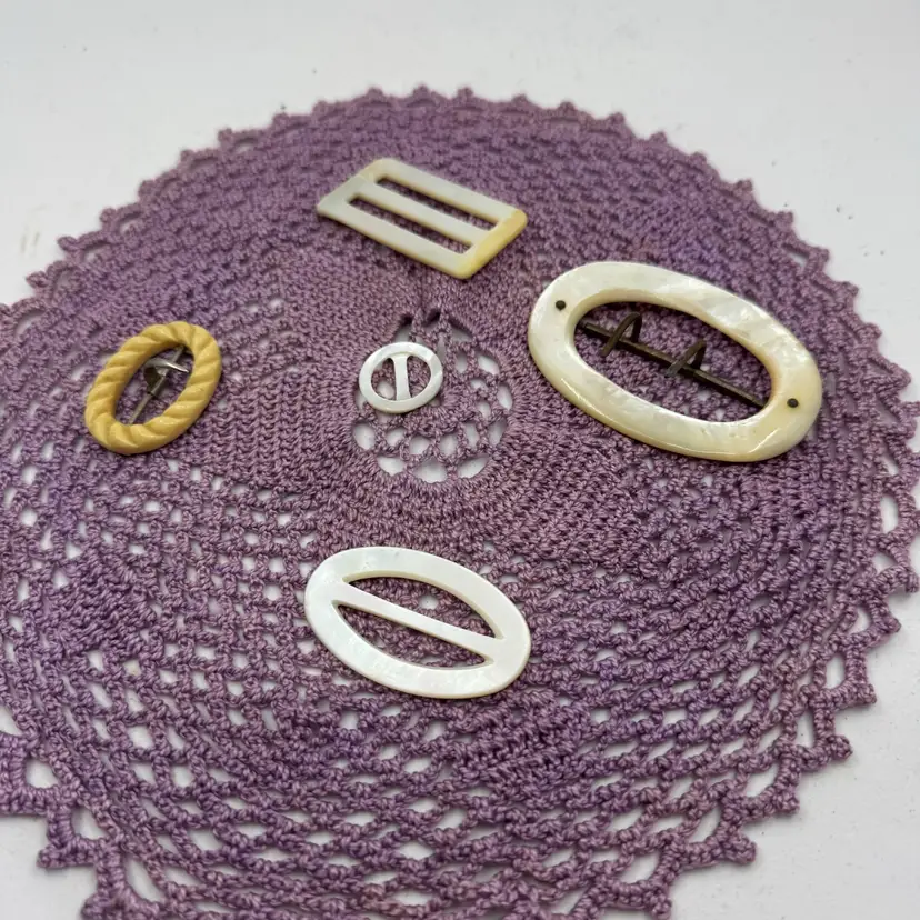 4 Antique oval mother-of-pearl And One Celluloid belt buckles