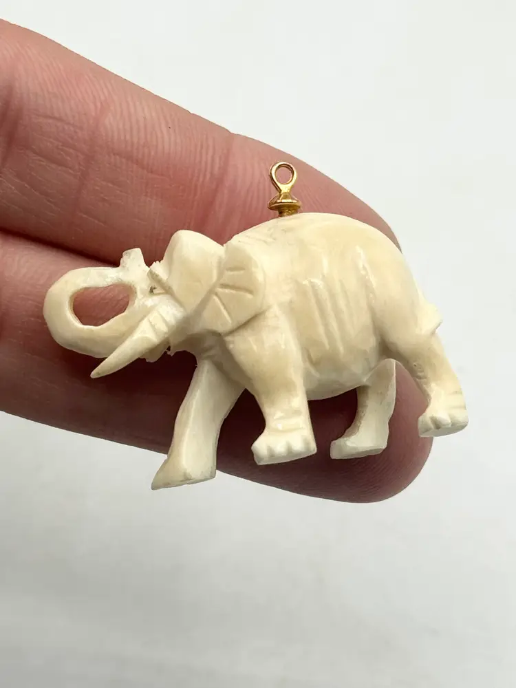 Estate carved figural elephant charm pendant