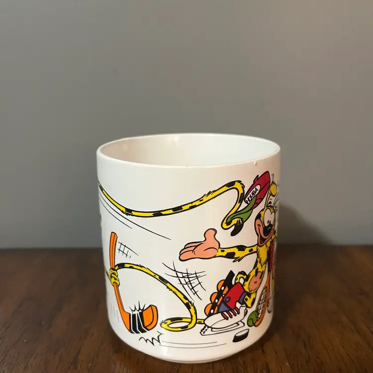 vintage coffee mug featuring the character Marsupilami, a comic book character created by André Franquin. The mug was produced by Applause,