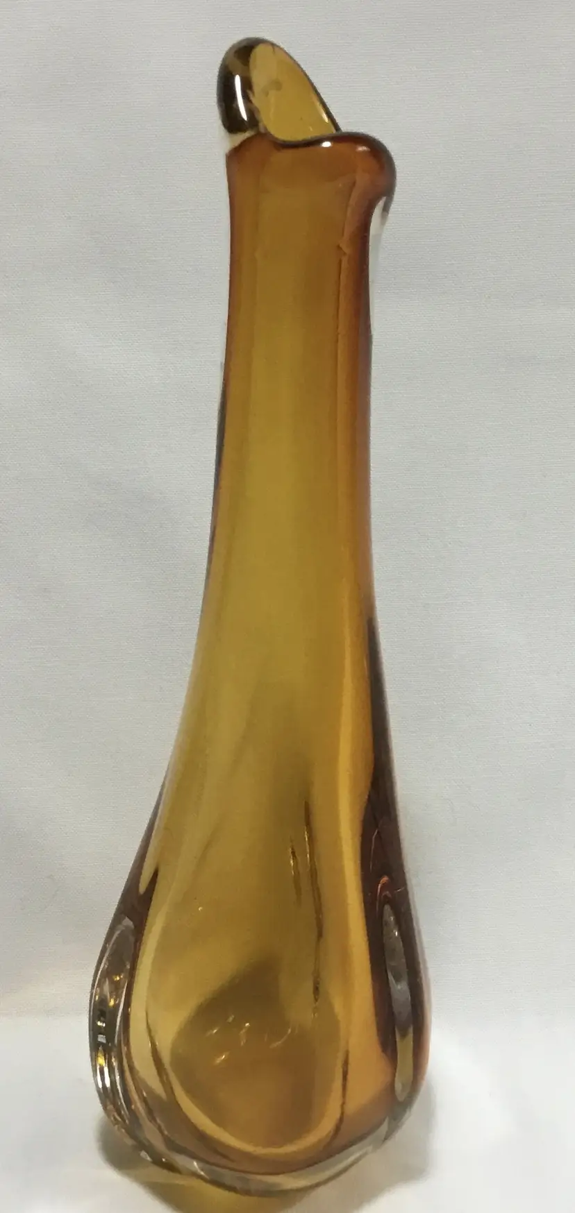 Hand blown, swung neck bud vase, medium amber color, artist signed 7.5"