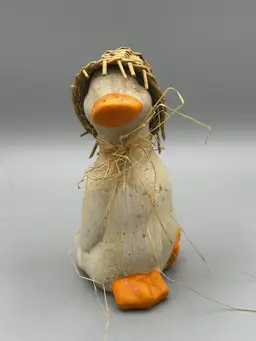 A duck with straw hat